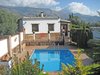 EL PLUMBAGO VILLA AND SIERRA NEVADA MOUNTAINS BEHIND